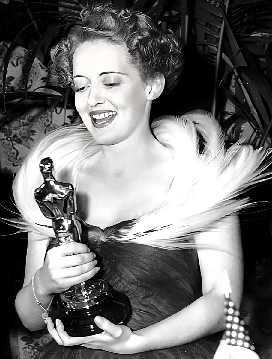 Bette Davis: Feather-trimmed gown