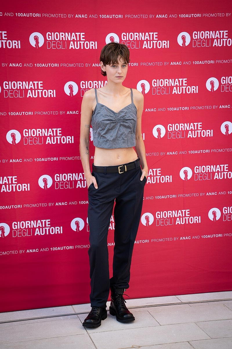Emma Corrin: Denim bustier and black trousers