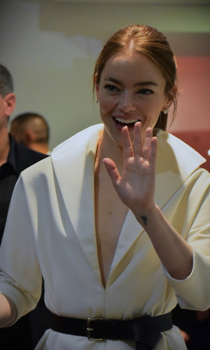 Emma Stone: Cream wrap dress and black belt