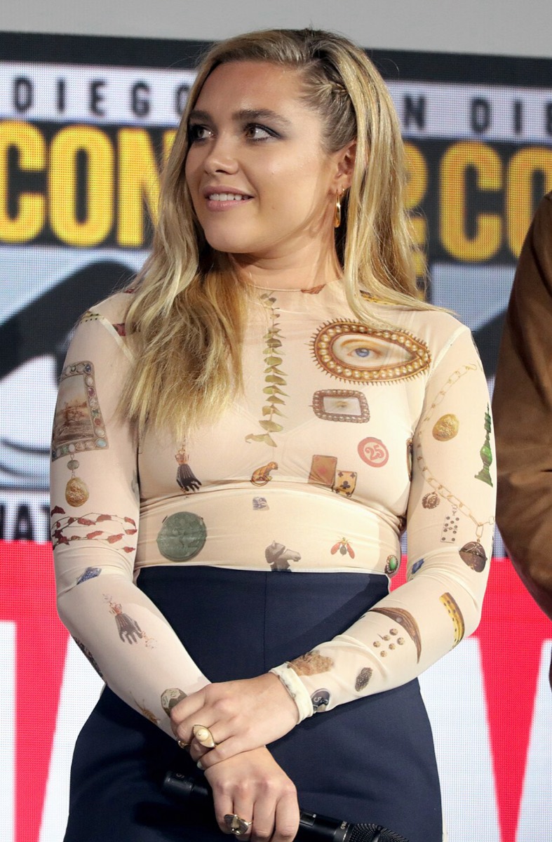 Florence Pugh wearing printed sheer top and navy trousers at Comic-Con 2019
