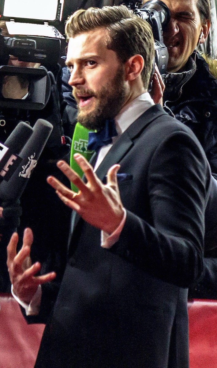Jamie Dornan wearing black suit and white shirt at Fifty Shades of Grey premiere 2015