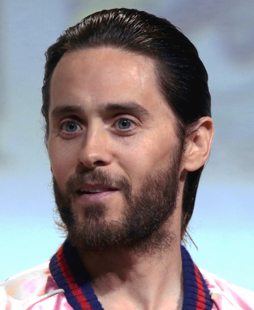 Jared Leto wearing pink bomber with striped collar at Comic-Con 2016