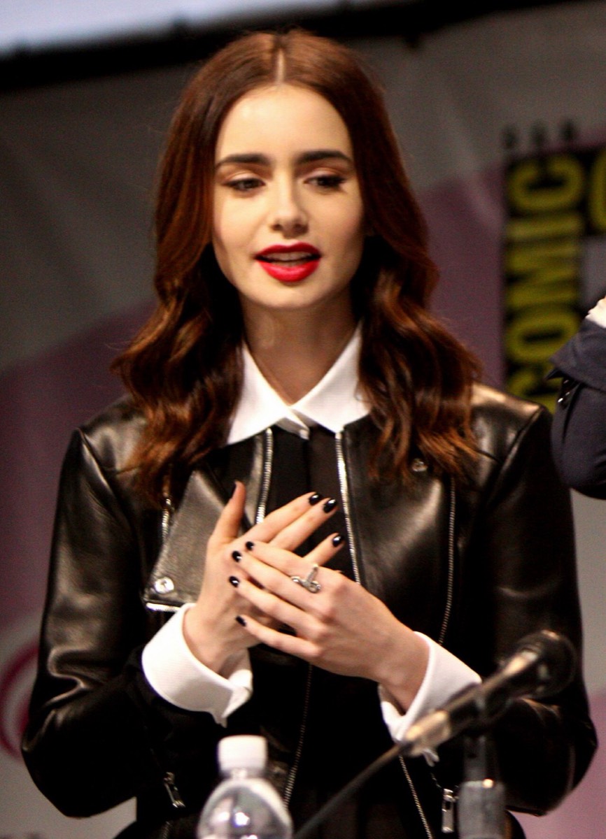 Lily Collins: Leather jacket and white collar