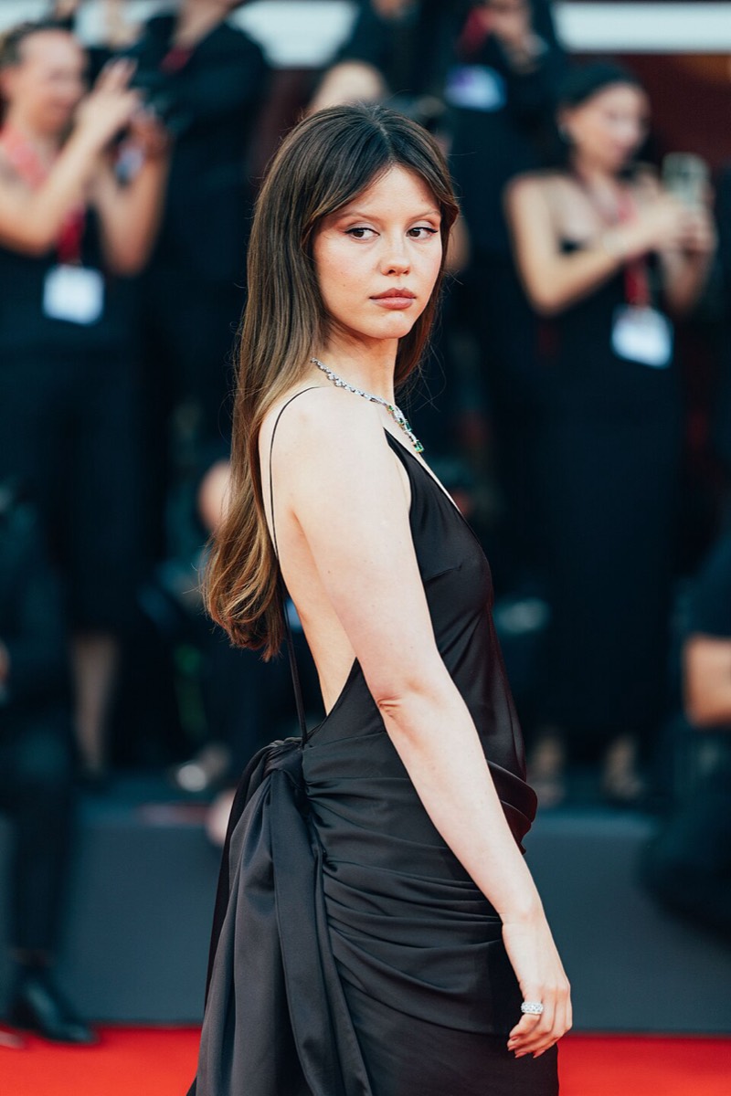 Mia Goth: Black backless satin gown