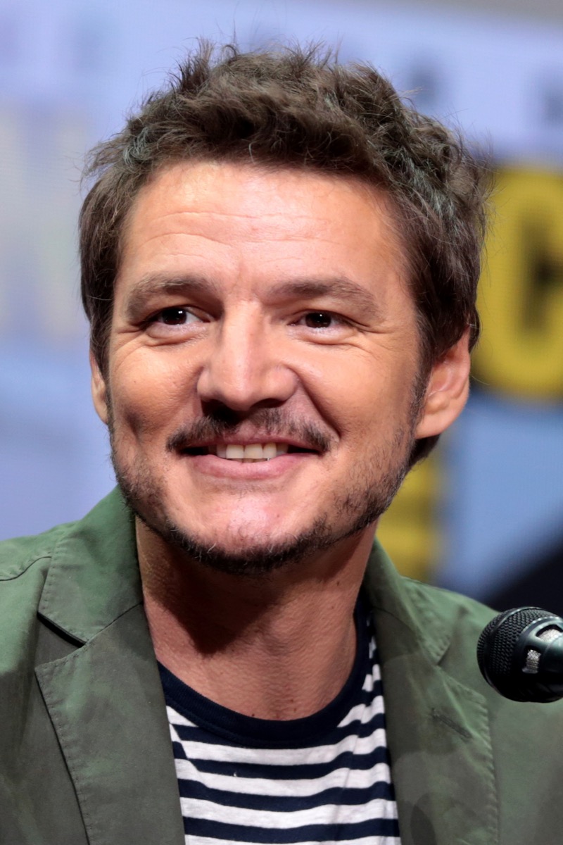 Pedro Pascal wearing green jacket and striped t-shirt at Comic-Con 2017