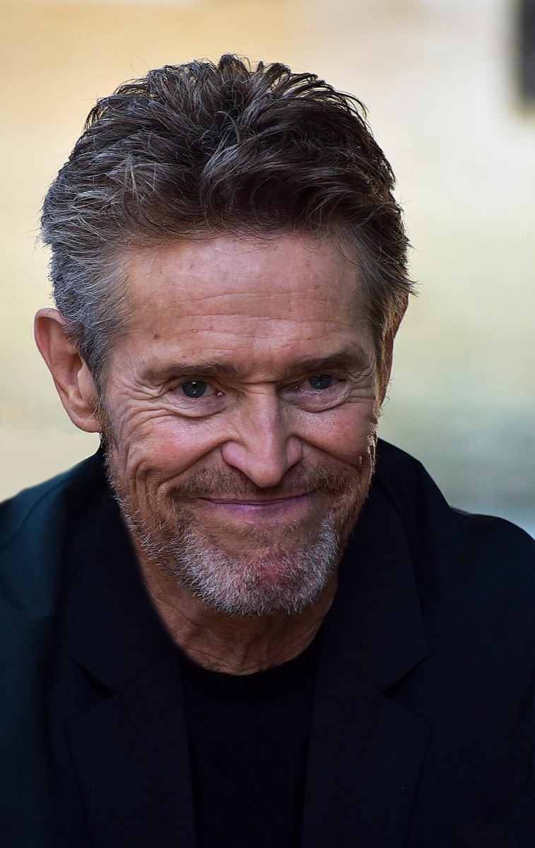 Willem Dafoe: Navy jacket and black knit