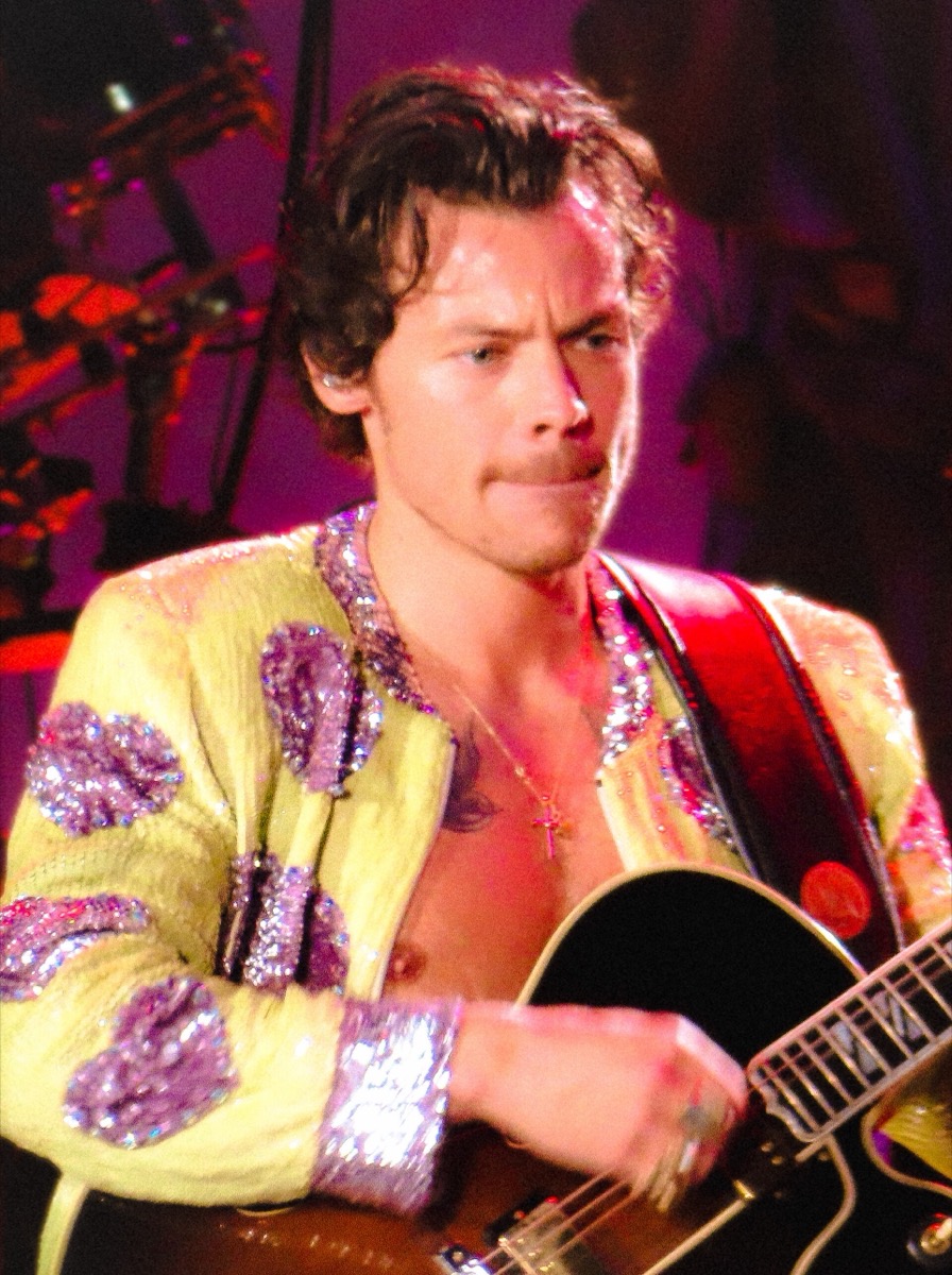 Harry Styles wearing yellow jacket with sequin spots at Love On Tour