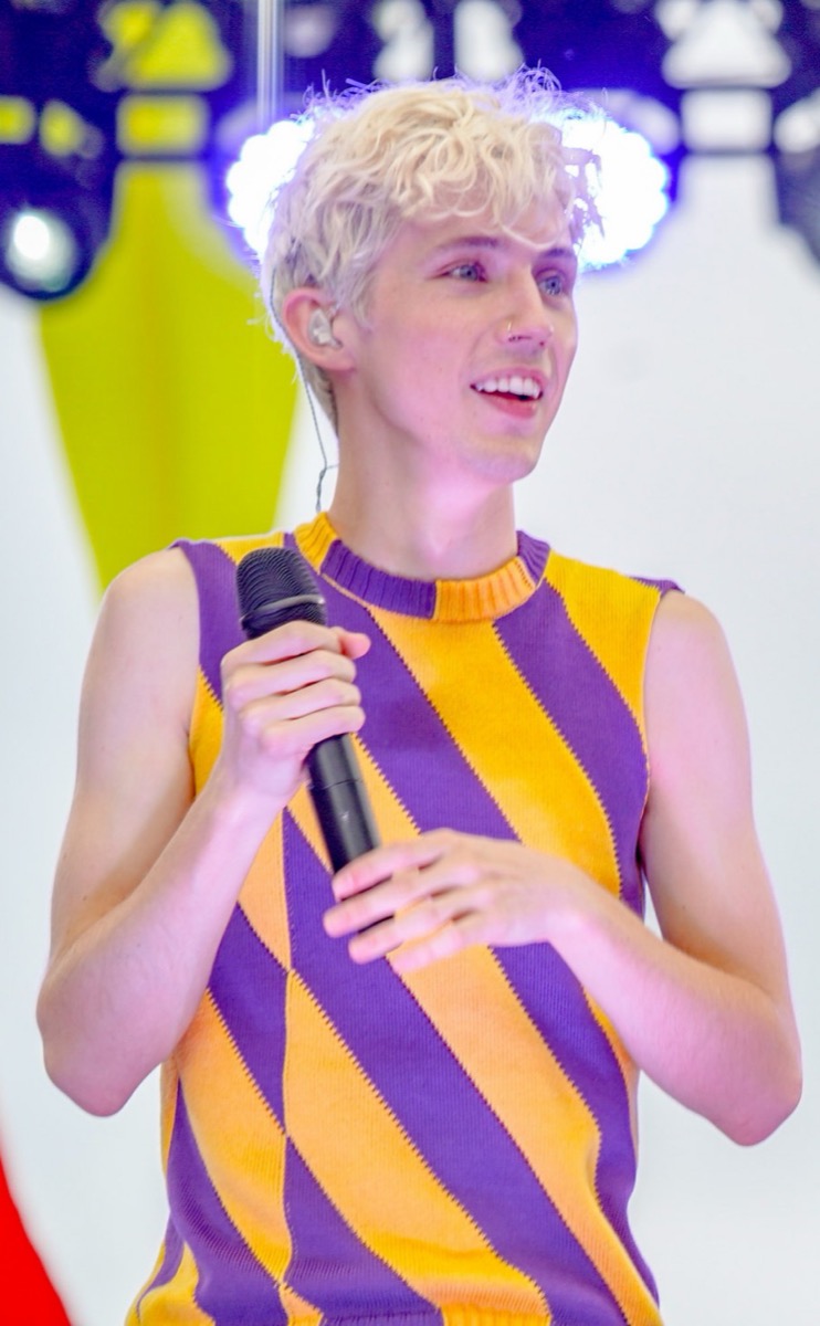 Troye Sivan wearing striped knit vest at Capital Pride